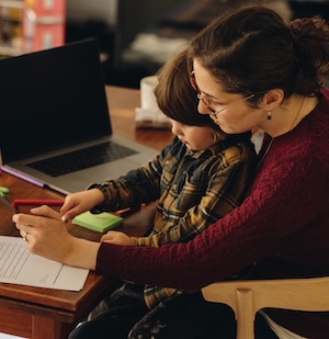 A mother teaching her child at home